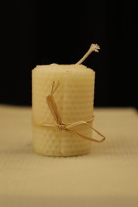 Close-up of bread on table against black background