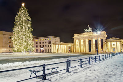 View of illuminated building during winter at night