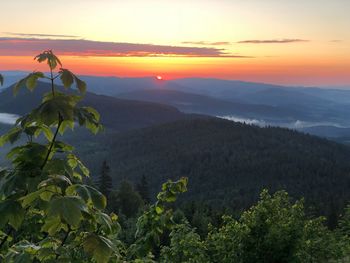 Scenic view of mountains against sky during sunset