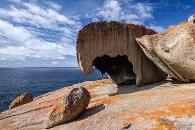 Remarkable rocks in sea against sky
