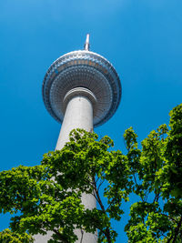 Low angle view of tower against blue sky