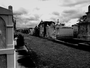 Buildings against cloudy sky