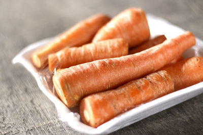 Close-up of carrots in plate on table