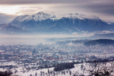 Scenic view of mountains against sky during winter