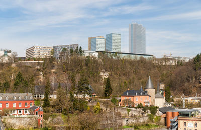 Buildings in city against sky