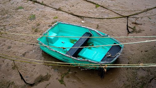 High angle view of boat moored on shore
