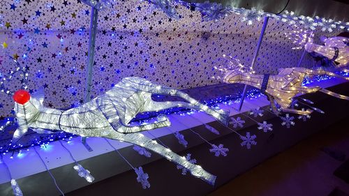 Close-up of illuminated lighting equipment at night