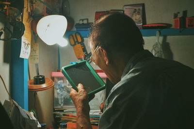 Portrait of man working on table