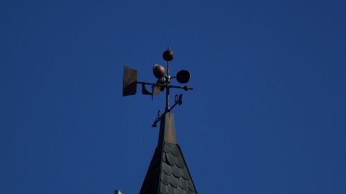 Low angle view of built structure against clear blue sky