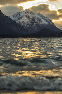 Scenic view of lake with mountains in background