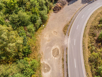 High angle view of curve road trees