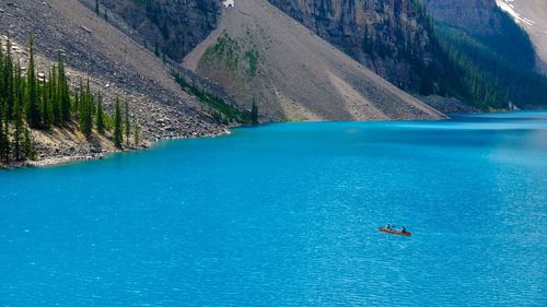 High angle view of person on blue sea