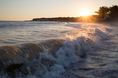 View of calm sea at sunset