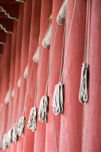 Close-up of clothes hanging on brick wall