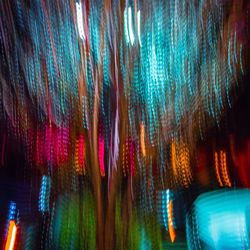 Close-up of illuminated water against sky at night