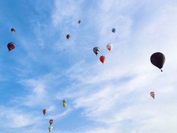Low angle view of balloons flying in sky