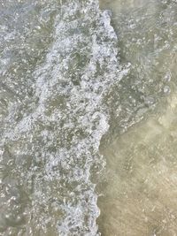 High angle view of water splashing in sea