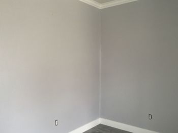 Low angle view of white wall and ceiling in building