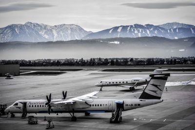 View of airport runway against mountains