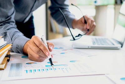 Close-up of man working on table
