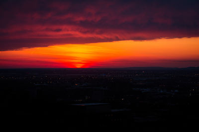 Scenic view of sunset over city