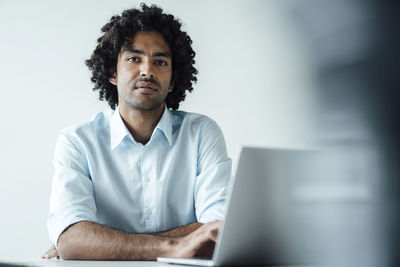 Portrait of man using mobile phone