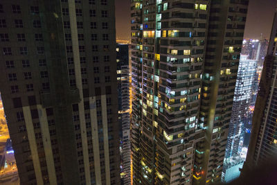 Aerial view of city lit up at night