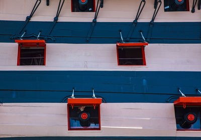 Low angle view of red car on building