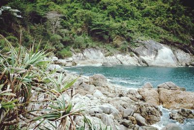 Scenic view of rocks by sea