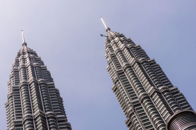Low angle view of petronas towers against sky in city