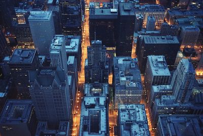 Low angle view of illuminated cityscape at night