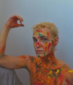 Portrait of young man with face paint