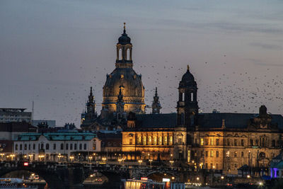 Illuminated buildings in city at night
