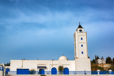 Low angle view of building against blue sky