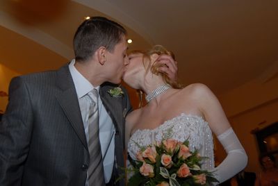 Couple kissing during wedding ceremony
