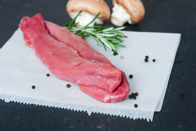 Close-up of meat on cutting board