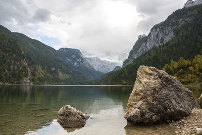 Scenic view of lake and mountains against sky