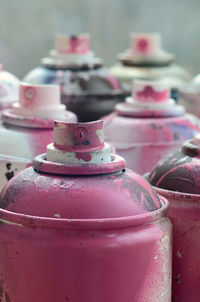 Close-up of pink spray bottles