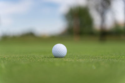 Close-up of ball on grassland