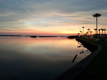 Scenic view of lake against sky during sunset