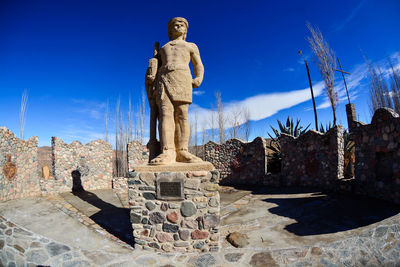 Low angle view of built structure against blue sky