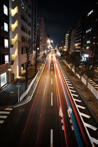 High angle view of light trails on road at night