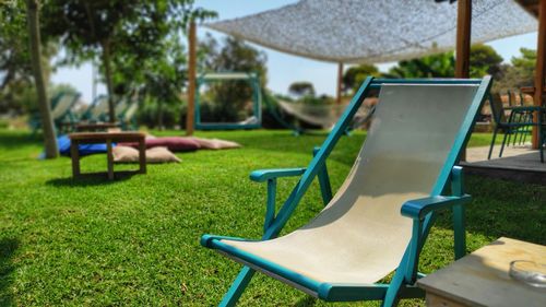 Empty chairs and tables in park