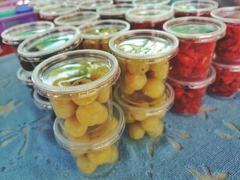 High angle view of fruits in jar on table