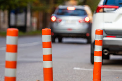 Traffic cones on road in city