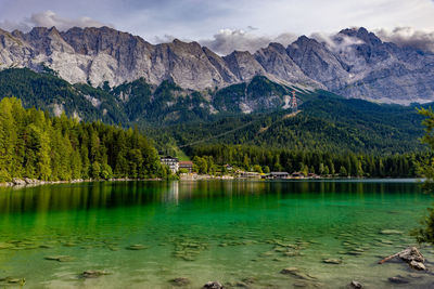 Scenic view of lake and mountains against sky