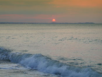 Scenic view of sea against dramatic sky