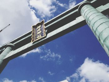 Low angle view of torii gate at kanda shrine against sky