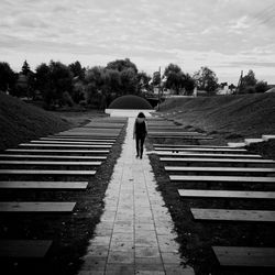 Rear view of man and woman walking on steps