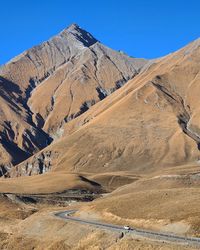 Scenic view of snowcapped mountains against clear sky